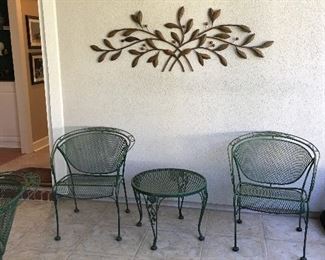 green iron patio chairs and table