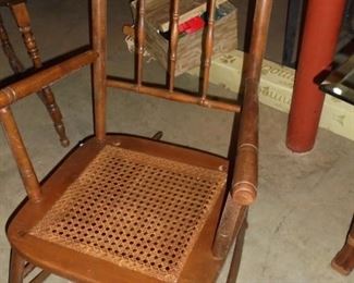 Antique spindle rocker w/cane seat