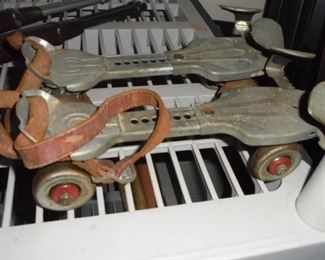 Vintage metal roller skates w/metal wheels and original unbroken leather straps