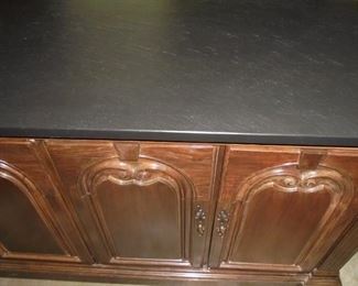 Side table w/black slate top & 5 doors w/4 drawers