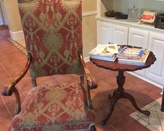 Regal looking chair with a nice mahogany pie crust side table.