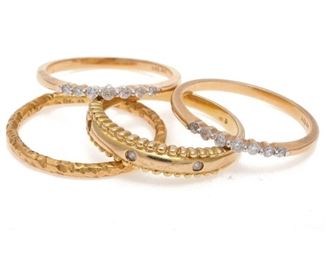 Collection of Four Diamond, Yellow Gold Stacking Rings