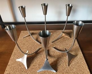 Vintage MCM 6-Piece Stainless Candle Holder Set--arranged on cork mat.