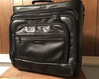 Handsdome/Beautiful Leather Compact Travel Bag w/Handle and Wheels--you'll save $ every time you use it!