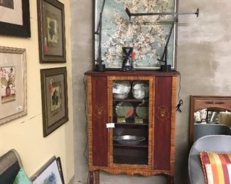 Great rug, vintage china, modern desk lights and large painting