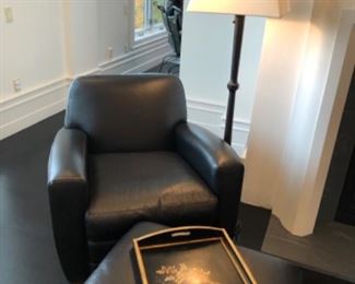 Restoration Hardware leather chair and ottoman shown with floor lamp by Eddie Bauer Home and hand painted wooden tray