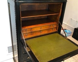Photo of antique secretaire open with leather writing surface.