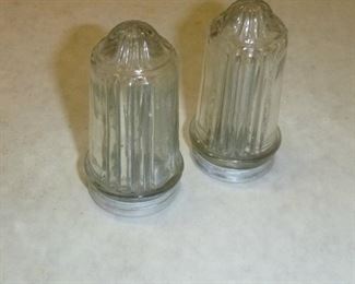 very unique salt & pepper shaker set from 1929, the salt & pepper come out the bottom of these. They were invented as anti-humidity shakers.