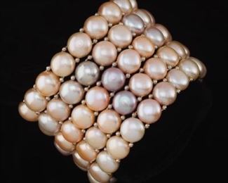 A Set of Five Button Pearl Bracelets 