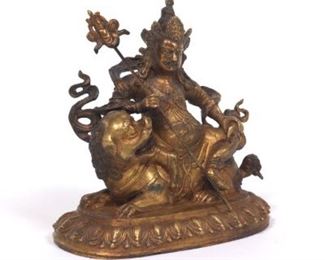 Antique Tibetan Gilt Bronze Sculpture of Yellow Jambhala Mammon God of Wealth on Foo Lion, ca. 19th Century