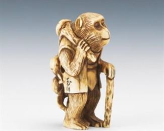 Japanese Carved Sperm Whale Tooth Netsuke of a Monkey with a Branch of Peaches 