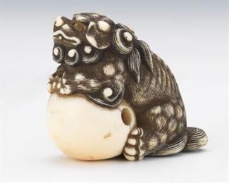 Japanese Carved Sperm Whale Tooth Netsuke of Foo Lion with a Ball 