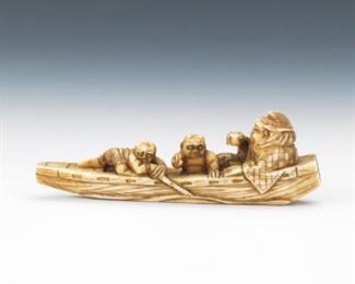 Japanese Carved Sperm Whale Tooth Netsuke of Immortal Traveling on a Boat with Two Spirits 