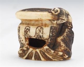 Japanese Carved Walrus Tusk Netsuke of Two Boys Trying to Hold an Overturned Cauldron 