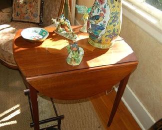 Inlaid drop leaf table by Baker