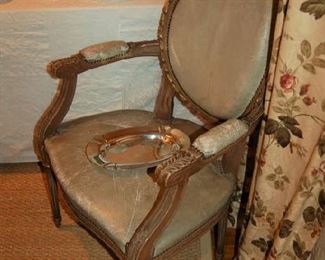 Two open-arm leather chairs