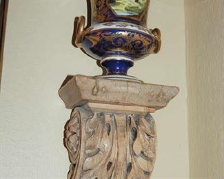 Pair of carved wall brackets with porcelain urns