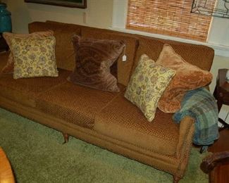 Three-place upholstered sofa and custom pillows