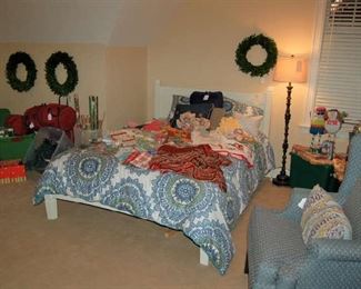 Queen bed and wing chair in Christmas room