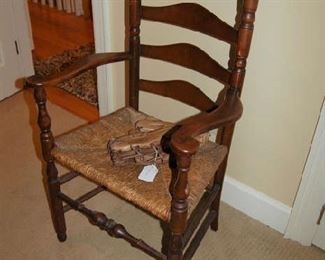One of two rush bottom arm chairs