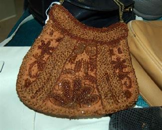 Beaded purse among name brand handbags