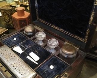 19th century travel vanity case with glass bottles.