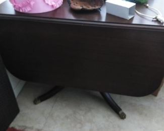 Wonderful Antique double drop leaf dining room table with drawers. Metal feet tips