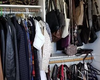 Lots of purses and coats and clothes. There are also 2 large commercial racks full plus more in this room and more in the master closet.