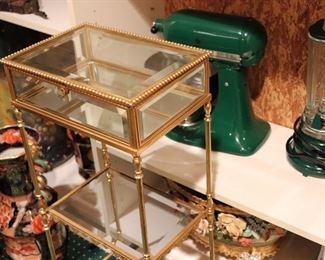 Gold Metal and Glass Display Table with Green KitchenAide and Blender