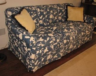 Blue and white floral upholstered sofa