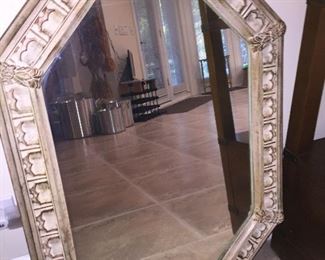 A mirror with white trim