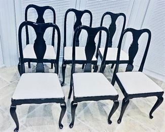 $40 per chair. Set of 6 chairs. Black lacquer with upholstered seat cushions. Pair with black round wood dining table with four leaves that extends to oval table. Solid and heavy. Round Table Diameter: 52 inches. Oval Table Diameter Width 51 x Length 95 x Height 29".  6 chairs sold together or separately.