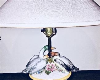 A pretty lamp with two ducks, flowers and pink flower finial.