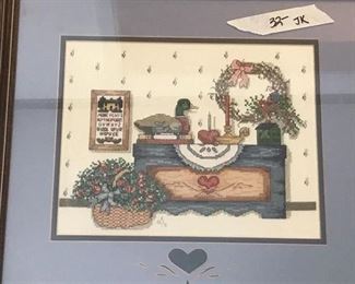one of several cross stitched pieces