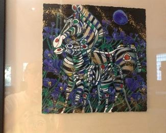 HIDEOUS GREMLIN on the frame! Lower left, it's wearing glasses and a t-shirt with a moon face on the front! SOMEBODY DO SOMETHING!