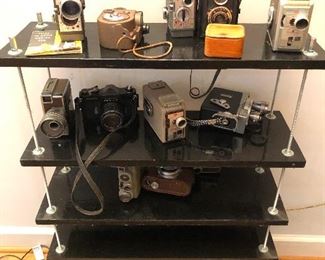 Hungry vintage cameras gather on the outskirts of the picnic hoping for some scraps