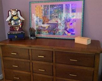 9-drawer dresser with cat-angel perched on top. Lucky dresser