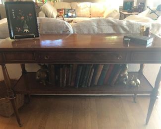 sofa table with authentic books, which are things we used to use for entertainment before smart phones melted our minds