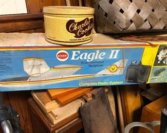 This is one of those balsam wood airplane models that is controlled by remote control. (In Spanish class I was told if I didn't know the name of something I should just describe it in rudimentary terms. Like an ATM machine is "la maquinita donde puedo conseguir dinero," (the little machine where I can get money). This knowledge has crossed over into my English captions of this stuff.) (You're welcome)