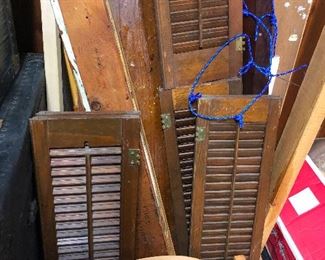 Cool old wooden shutters!! For some reason I love these things. I line my fence with them.