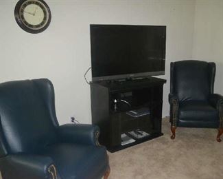 wing back recliners, flat screen television, media stand