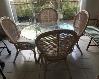 Rattan / Glass top table / 4 chairs $ 188.00
