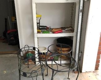 Metal plant stands, interesting stuff on shelf...