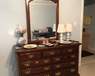 Solid wood dresser with mirror, hand painted lamp and two milk glass lamps