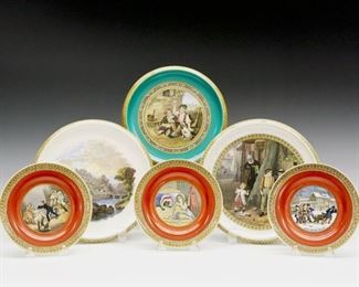 Six Pieces of 19th Century Prattware.   English pottery transfer-decorated plates and trivets with polychrome scenes, some with accent colors of orange and green.  No apparent markings.  Plates with added attachments to be mounted to a wall.  Wear to the decoration and surface scratches, crazing, and two with fine cracks.  From 5 1/2" to 8" diameter.  
