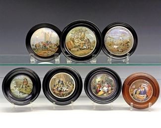 Seven 19th Century Prattware Pot Lids.  English pottery transfer-decorated pot lids with polychrome scenes including "Snap Dragon",  "Landing the Catch", "Golden Horn-Constantinople", and "A Fix"; all conforming frames, six of which are black.  Crazing and some wear and light surface scratches to each.  Up to 6" diameter overall. 