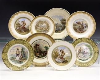 Eight 19th Century Prattware Plates.  English pottery transfer-decorated Plates with polychrome scenes, one stamped "No. 123".  Two with wire attachments to be mounted to a wall.  Crazing, light wear to the decoration, and surface scratches overall.   From 7 1/4" to 9" diameter.  