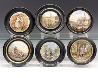 Six 19th Century Prattware Pot Lids.  English pottery transfer-decorated pot lids with polychrome scenes including "Vue de la Ville de Strasbourg Prise Du Port" and "No!  By Heaven I Exclaime May I Perish…"; all within a conforming black frame.  Crazing and some wear and light surface scratches to each. Up to 6 3/4" diameter overall.  