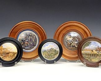 Five 19th Century Prattware Pot Lids.  English pottery transfer-decorated pot lids with polychrome scenes including "The Game Bag", "War", "On Guard", and "The Allied General's…"; all in a conforming black frame.  One with a partial "John Burgess & Son" label and another with "Cash Chemists Boots Art Dept" label verso.  Wear and light surface scratches to each, some with crazing and one with losses evident at the underside.  Up to 7" diameter overall.  
