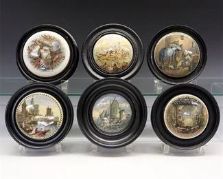 Six 19th Century Prattware Pot Lids.  English pottery transfer-decorated pot lids with polychrome scenes including "Country Quarters", "Strasburg", "Choir of the Chapel Royal Savoy Destroyed by Fire July 7 1864"; all within a conforming black frame.  Crazing and some wear and light surface scratches to each. Up to 6 5/8" diameter overall. 